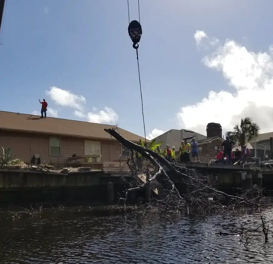 Full Bushor's crew in hi-vis on a waterfront crane removal